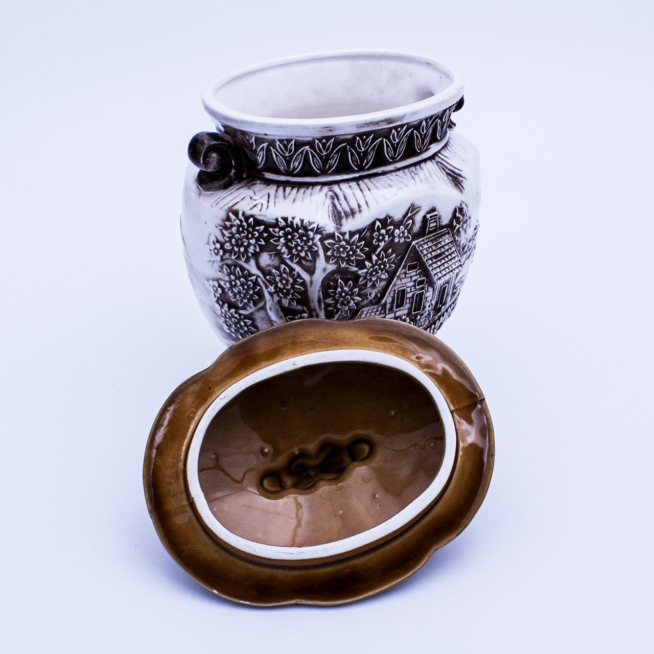 Cream Ceramic Cookie Jar – Raised Cottage Scene, Brown Glaze Accents