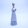 Springtime Serenity – Lladró-Style Porcelain Girl Holding Flowers