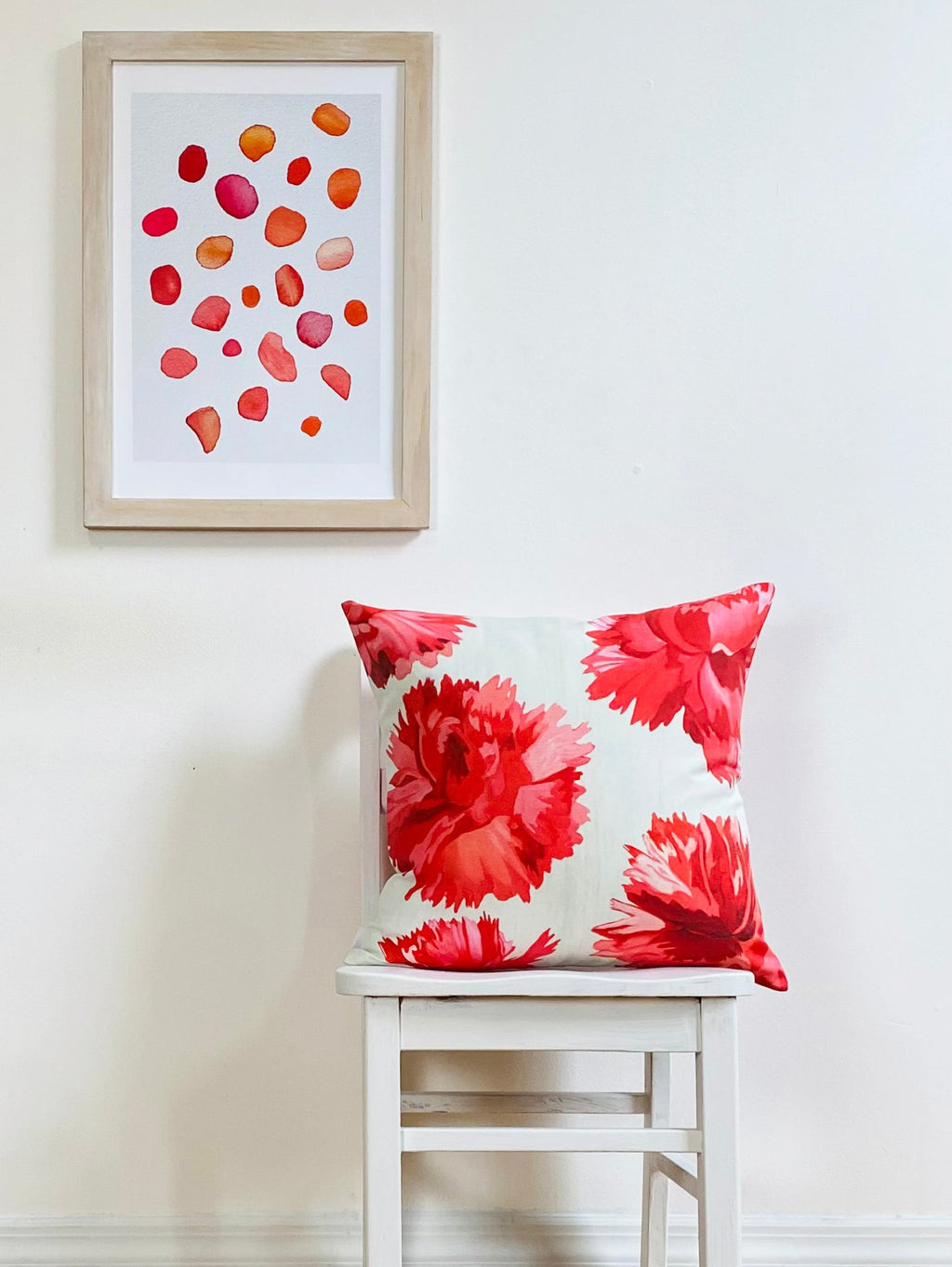 Throw Pillow: Red Carnations on Snow